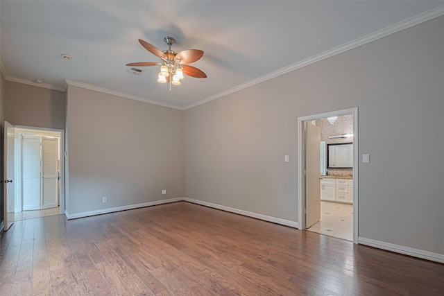11914 Ashmead Dr, Houston, TX 77077 - spare room with ceiling fan, ornamental molding, and wood-type flooring