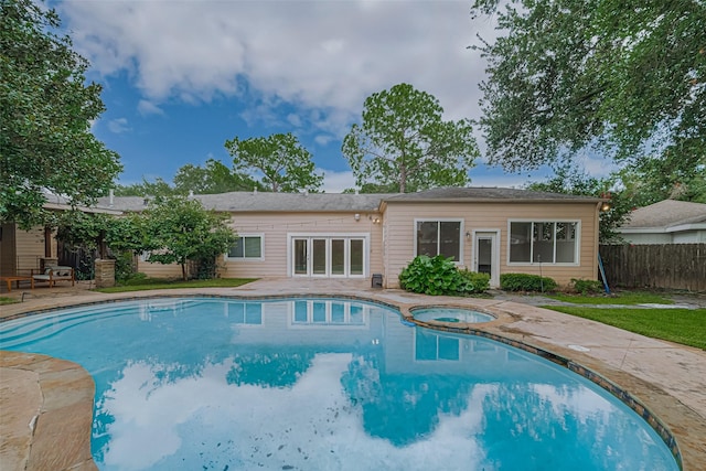 11914 Ashmead Dr, Houston, TX 77077 - view of pool featuring a pool with connected hot tub and a patio area