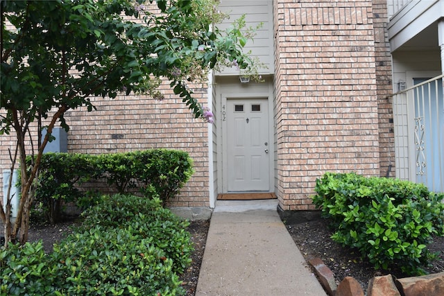 10615 Briar Forest Dr Unit 402, Houston, TX 77042 - view of exterior entry with brick siding