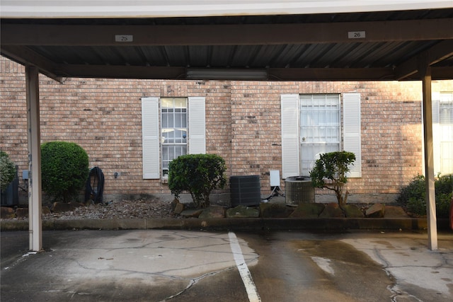 10615 Briar Forest Dr Unit 402, Houston, TX 77042 - doorway to property featuring brick siding and covered parking