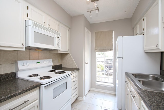 10615 Briar Forest Dr Unit 402, Houston, TX 77042 - kitchen with white appliances, white cabinetry, and dark countertops