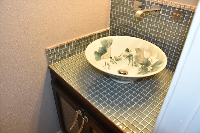 10615 Briar Forest Dr Unit 402, Houston, TX 77042 - bathroom view of a textured wall, tile walls, and vanity
