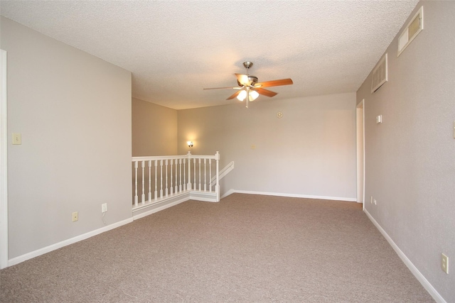 10615 Briar Forest Dr Unit 402, Houston, TX 77042 - spare room featuring ceiling fan, carpet, and a textured ceiling