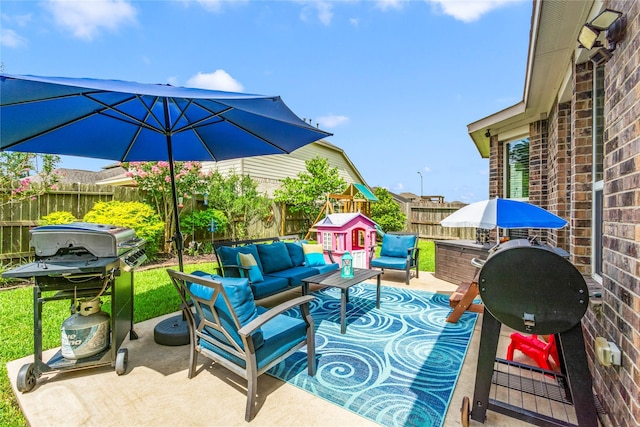 9906 Deborah Colony Ln, Humble, TX 77396 - fenced backyard featuring an outdoor hangout area, area for grilling, and a patio