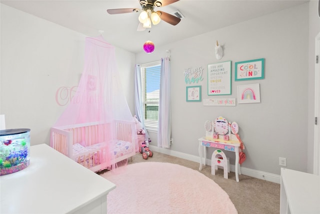 9906 Deborah Colony Ln, Humble, TX 77396 - bedroom featuring light colored carpet, a crib, and ceiling fan