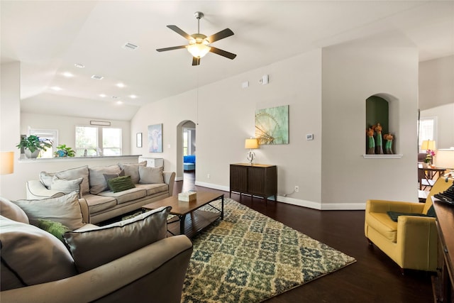 9906 Deborah Colony Ln, Humble, TX 77396 - living area featuring arched walkways, ceiling fan, dark wood-style flooring, lofted ceiling, and recessed lighting