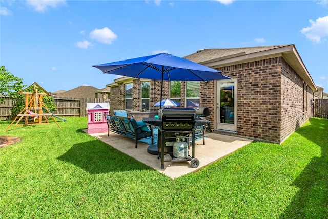 9906 Deborah Colony Ln, Humble, TX 77396 - fenced backyard with a playground and a patio area