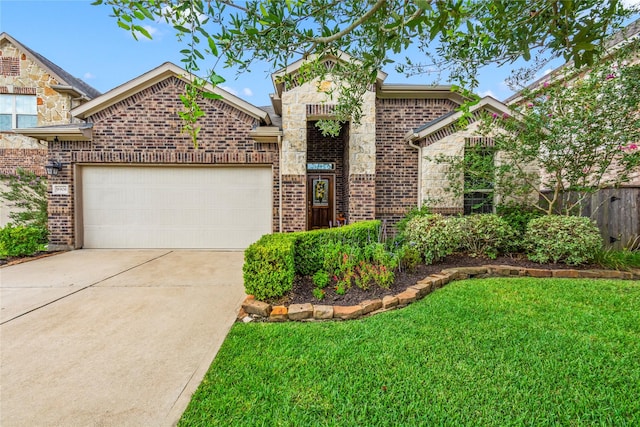9906 Deborah Colony Ln, Humble, TX 77396 - french country inspired facade featuring brick siding, a garage, driveway, and stone siding
