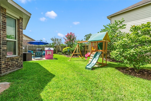 9906 Deborah Colony Ln, Humble, TX 77396 - fenced backyard featuring a playground and a patio area