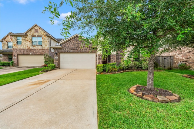 9906 Deborah Colony Ln, Humble, TX 77396 - view of front of house featuring brick siding, driveway, and a garage