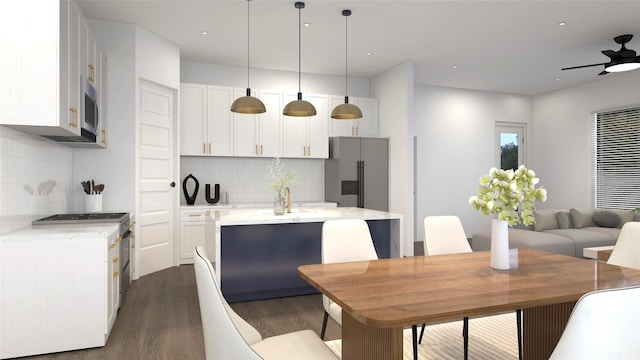2720 Spence Rd, Houston, TX 77093 - kitchen with appliances with stainless steel finishes, dark wood finished floors, a kitchen island, tasteful backsplash, and recessed lighting