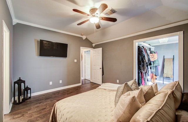 2516 Vaughn St, Houston, TX 77093 - bedroom with lofted ceiling, crown molding, dark wood finished floors, ceiling fan, and a walk in closet