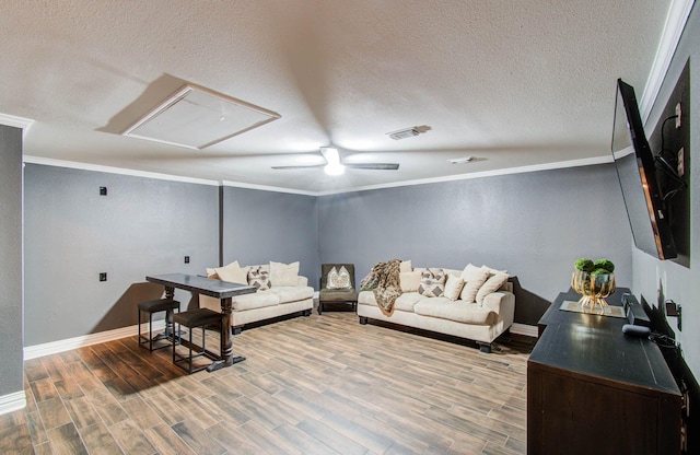 2516 Vaughn St, Houston, TX 77093 - living room with attic access, crown molding, a textured ceiling, wood finished floors, and ceiling fan