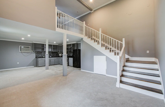 2516 Vaughn St, Houston, TX 77093 - staircase with carpet floors, a wall mounted AC, recessed lighting, crown molding, and a towering ceiling