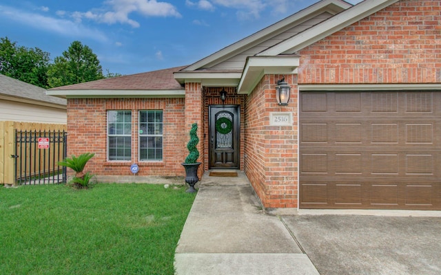 2516 Vaughn St, Houston, TX 77093 - doorway to property featuring brick siding, an attached garage, and driveway