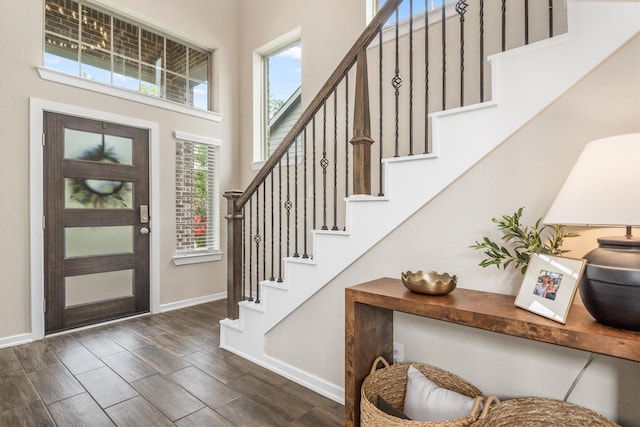 7906 Pershing Ave, Magnolia, TX 77354 - foyer featuring dark wood-type flooring, stairs, and a towering ceiling