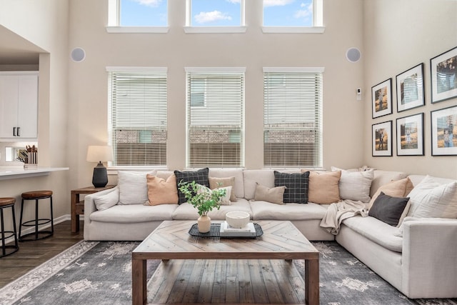 7906 Pershing Ave, Magnolia, TX 77354 - living room with a towering ceiling and dark wood finished floors