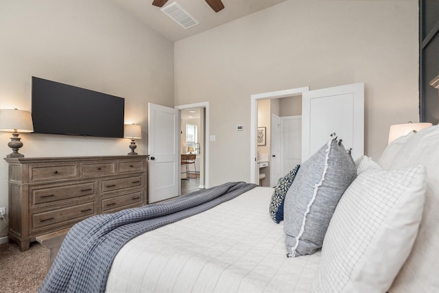 7906 Pershing Ave, Magnolia, TX 77354 - carpeted bedroom with high vaulted ceiling, ceiling fan, and ensuite bath