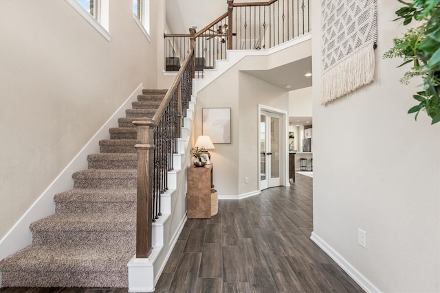 7906 Pershing Ave, Magnolia, TX 77354 - stairs with a high ceiling and wood finished floors