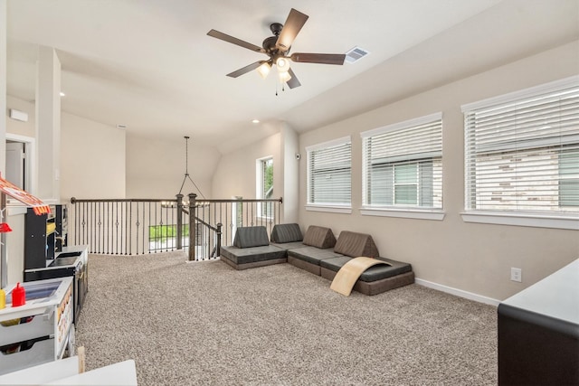 7906 Pershing Ave, Magnolia, TX 77354 - living area featuring ceiling fan, carpet flooring, and vaulted ceiling