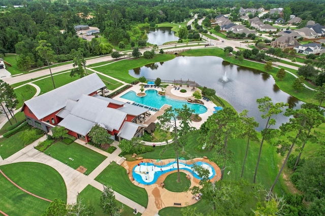 7906 Pershing Ave, Magnolia, TX 77354 - drone / aerial view of a pool area and a nearby body of water