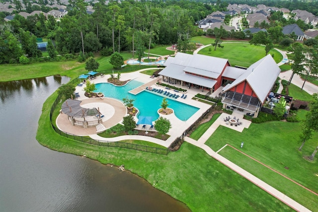 7906 Pershing Ave, Magnolia, TX 77354 - aerial view of a pool and a nearby body of water
