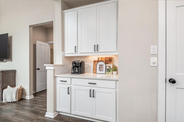 7906 Pershing Ave, Magnolia, TX 77354 - kitchen with decorative backsplash, light countertops, dark wood finished floors, and white cabinetry