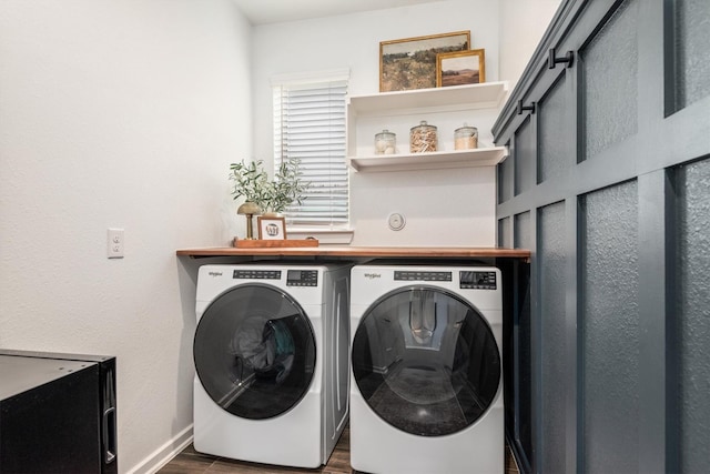 7906 Pershing Ave, Magnolia, TX 77354 - laundry area with washer and dryer and dark wood-style floors