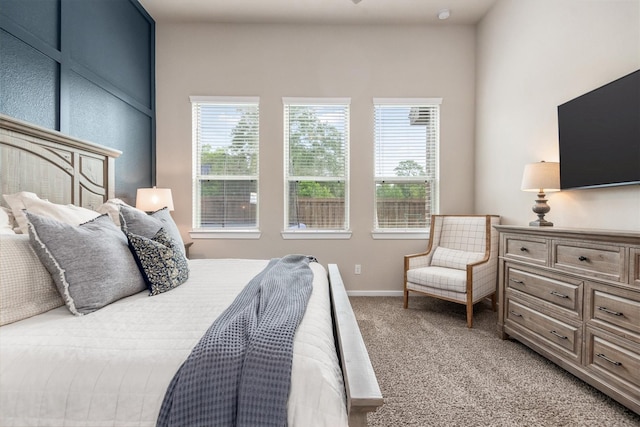 7906 Pershing Ave, Magnolia, TX 77354 - bedroom featuring light carpet and baseboards