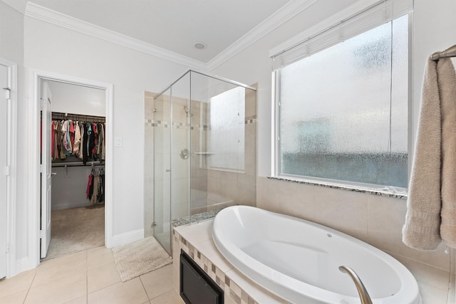 6 Inland Prairie Dr, Tomball, TX 77375 - bathroom featuring a shower stall, a bath, tile patterned floors, crown molding, and a spacious closet