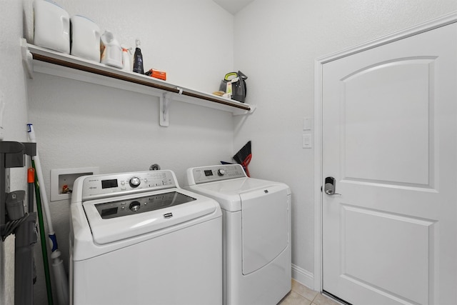 6 Inland Prairie Dr, Tomball, TX 77375 - washroom featuring washer and clothes dryer and light tile patterned floors