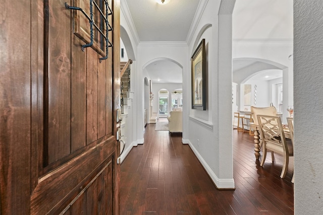 6 Inland Prairie Dr, Tomball, TX 77375 - hall featuring arched walkways, crown molding, and dark wood-style flooring