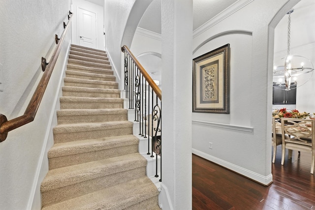 6 Inland Prairie Dr, Tomball, TX 77375 - stairway with wood-type flooring, ornamental molding, and arched walkways