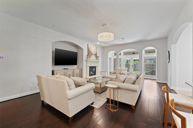 6 Inland Prairie Dr, Tomball, TX 77375 - living area with a glass covered fireplace, dark wood-type flooring, and french doors
