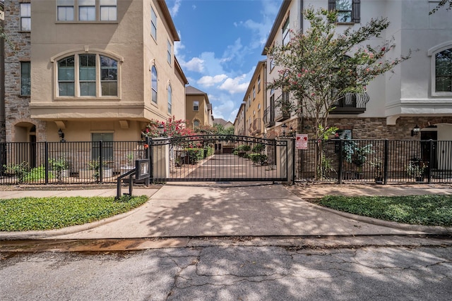 542 Bomar St, Houston, TX 77006 - view of concrete surface featuring a gate and a gated entry