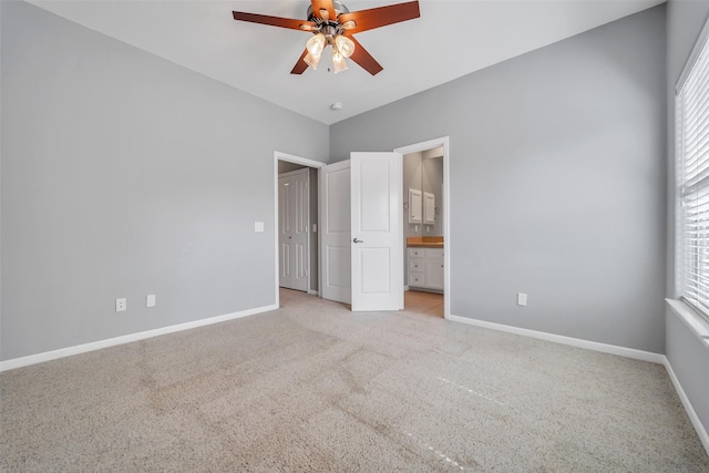 542 Bomar St, Houston, TX 77006 - unfurnished bedroom featuring light colored carpet, multiple windows, and ensuite bathroom