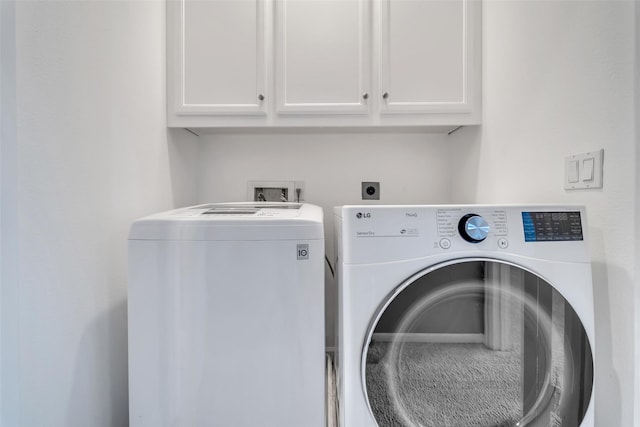 542 Bomar St, Houston, TX 77006 - laundry room featuring cabinet space and independent washer and dryer