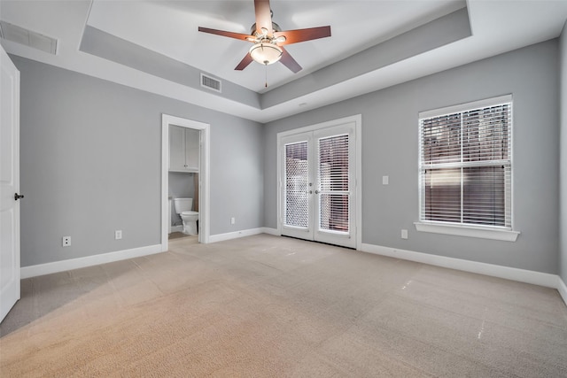 542 Bomar St, Houston, TX 77006 - unfurnished room featuring a raised ceiling, light colored carpet, and a ceiling fan
