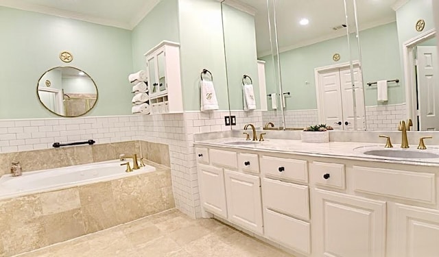 2006 Buffalo Ter, Houston, TX 77019 - bathroom featuring crown molding, a garden tub, and double vanity