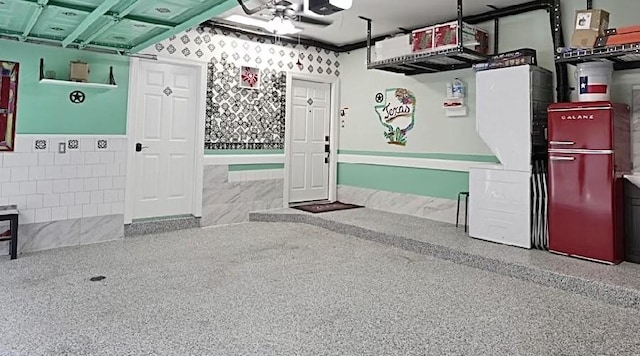 2006 Buffalo Ter, Houston, TX 77019 - garage with a wainscoted wall, a garage door opener, and a ceiling fan