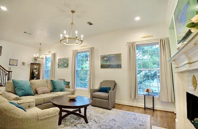 2006 Buffalo Ter, Houston, TX 77019 - living room featuring a chandelier, wood finished floors, stairs, crown molding, and a fireplace