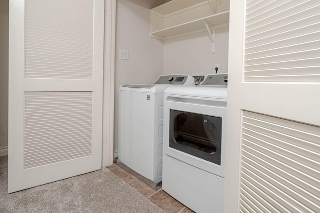 5817 Katy St, Houston, TX 77007 - laundry area with washer and clothes dryer and light tile patterned floors