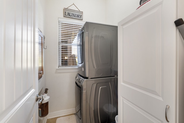 129 Lakeshore Dr, Onalaska, TX 77360 - laundry room with stacked washer / dryer and baseboards