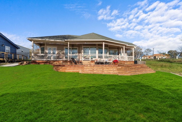 129 Lakeshore Dr, Onalaska, TX 77360 - back of house featuring a lawn and covered porch