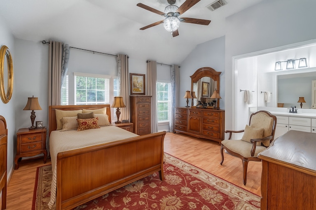 9706 Broadley Dr, Sugar Land, TX 77498 - bedroom with lofted ceiling, light wood-type flooring, ensuite bathroom, and a ceiling fan
