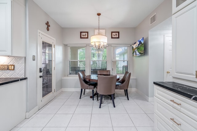 9706 Broadley Dr, Sugar Land, TX 77498 - dining space with a chandelier and light tile patterned floors