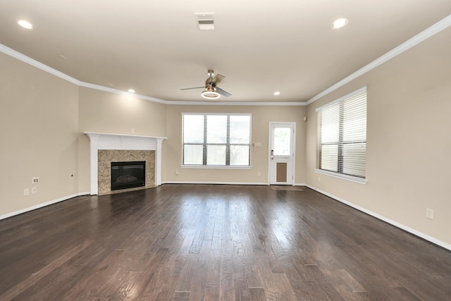 5627 Darling, Houston, TX 77007 - unfurnished living room with ceiling fan, dark wood-type flooring, ornamental molding, a high end fireplace, and recessed lighting