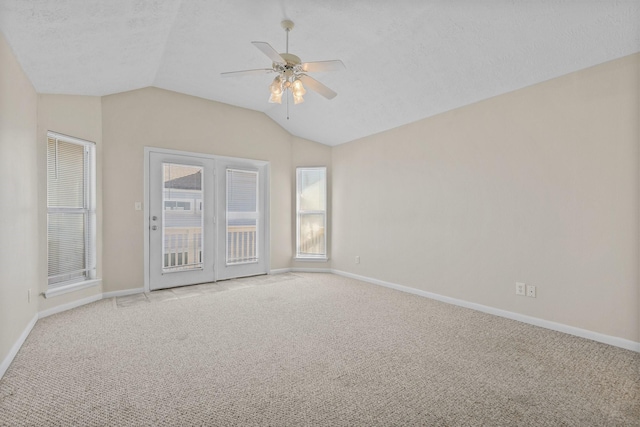 21315 Gulf Dr, Galveston, TX 77554 - empty room with ceiling fan, light colored carpet, and lofted ceiling