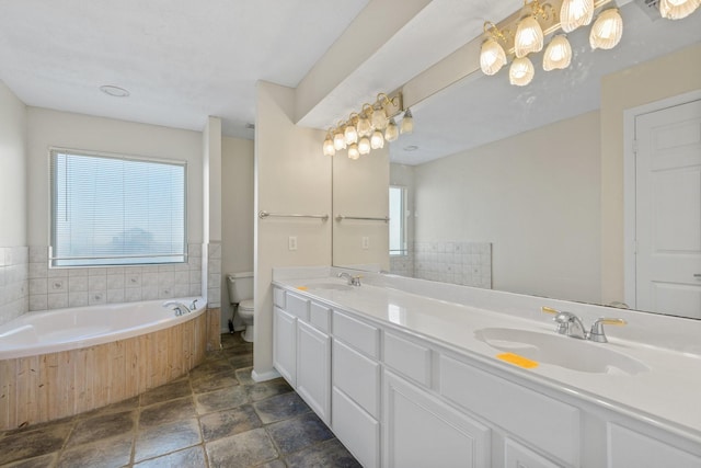 21315 Gulf Dr, Galveston, TX 77554 - full bath with a garden tub, double vanity, and stone finish floors