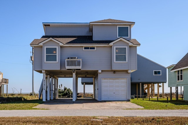 21315 Gulf Dr, Galveston, TX 77554 - beach home featuring stairway, driveway, an attached garage, a carport, and a shingled roof